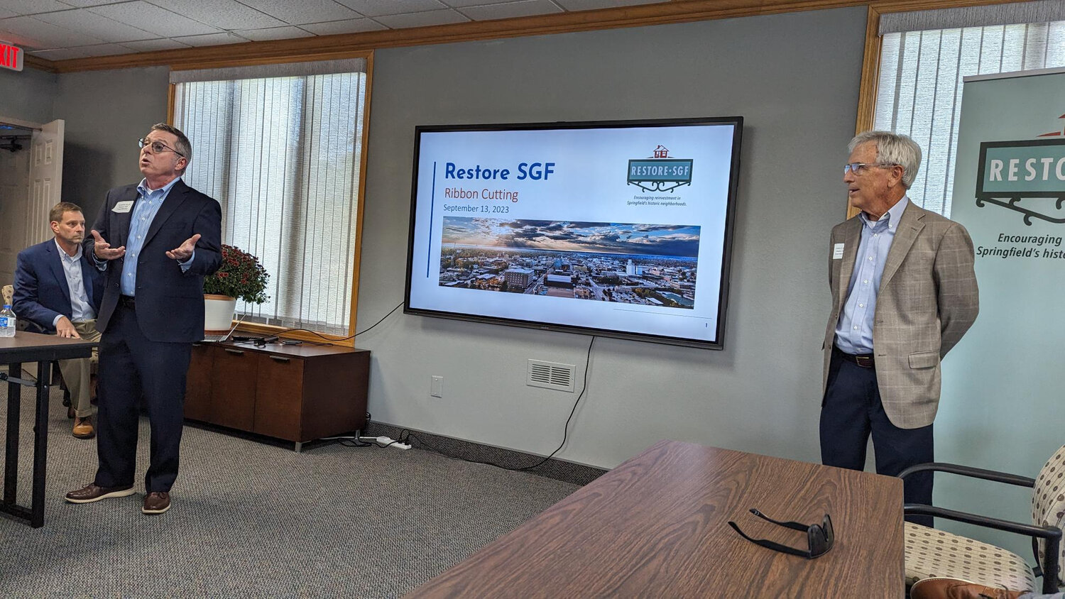 Restore SGF board member Richard Ollis introduces a block grant program during an open house at the organization’s new headquarters.